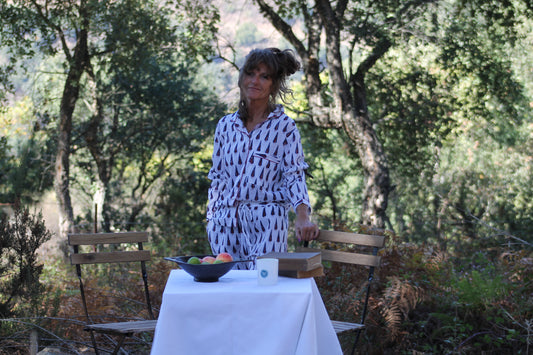 model showcasing white navy and red trees pyjama set close up