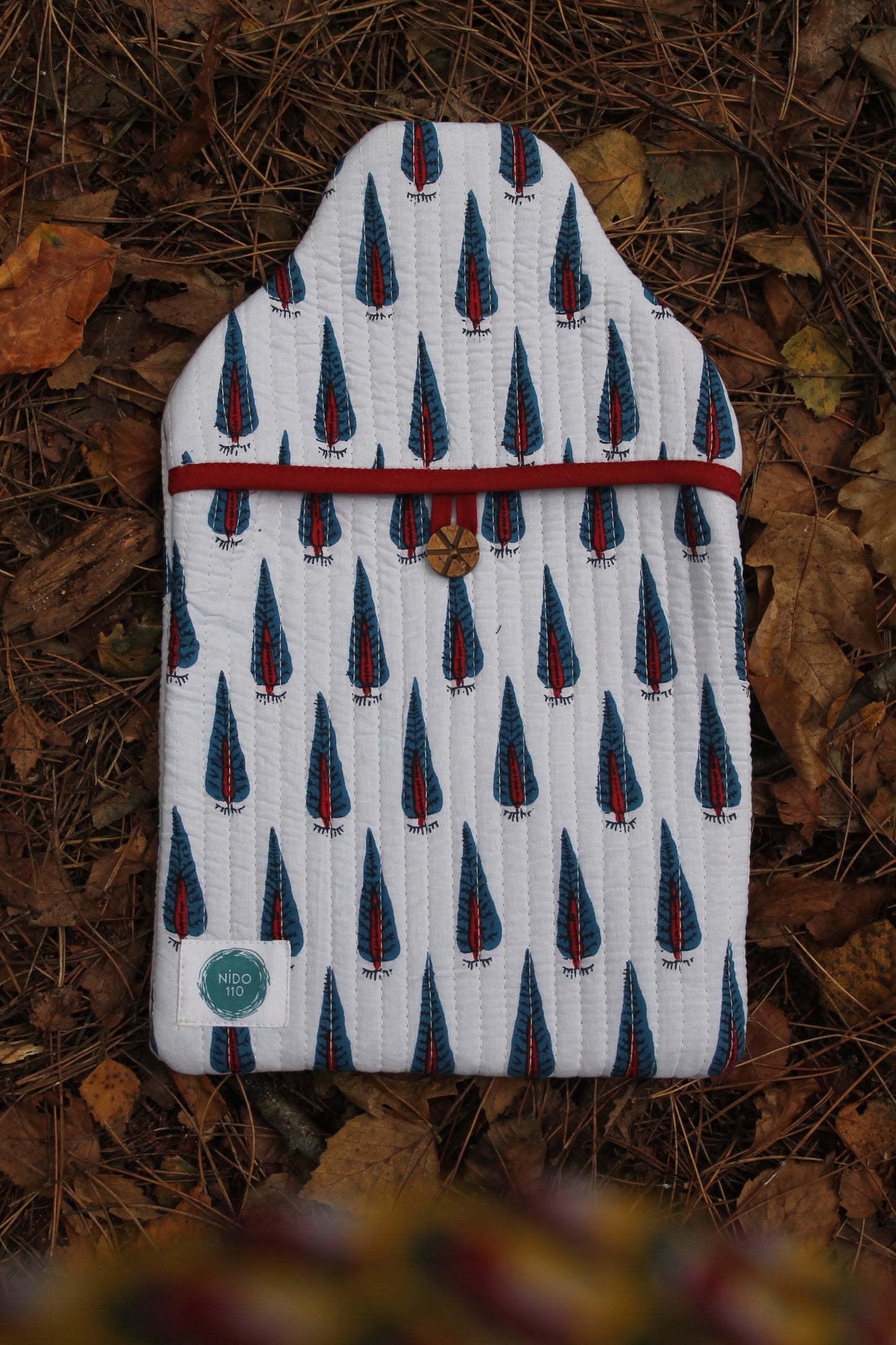 Hot water bottle and cover, trees design