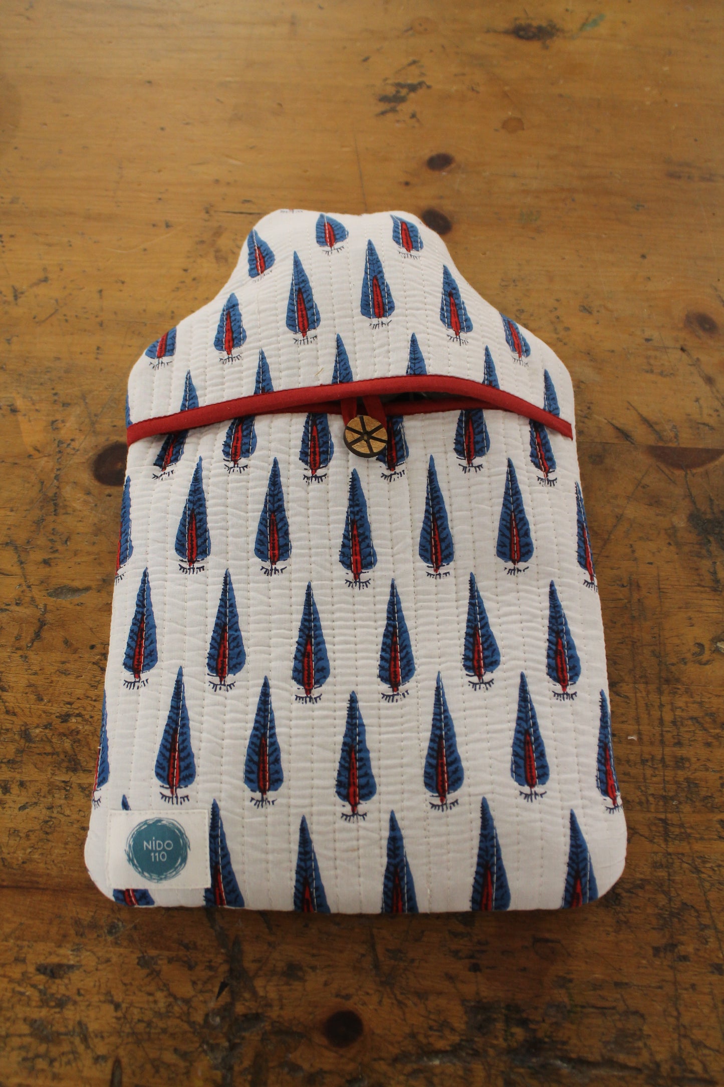 white red and blue block printed quilted hot water bottle with 2l bottle inside